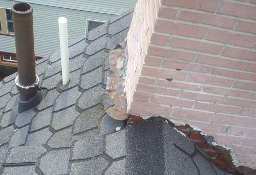 This is NOT good! The white pipe needs caulking and a boot at the bottom of it to properly seal it.